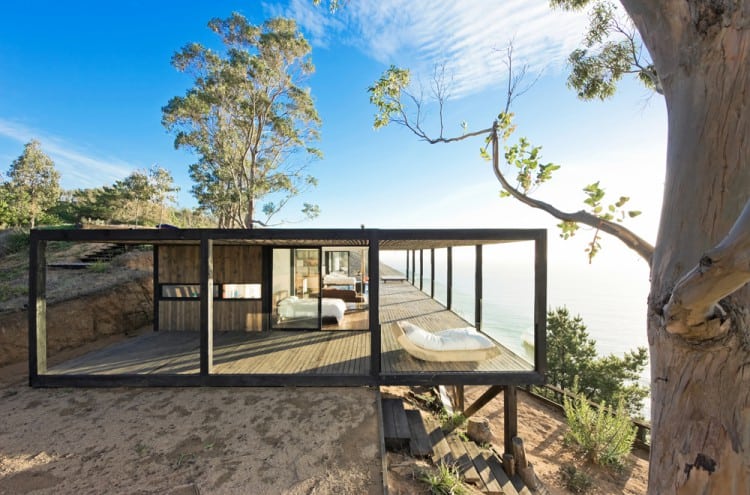 Coastal House on Bluff Designed to Blend into Landscape
