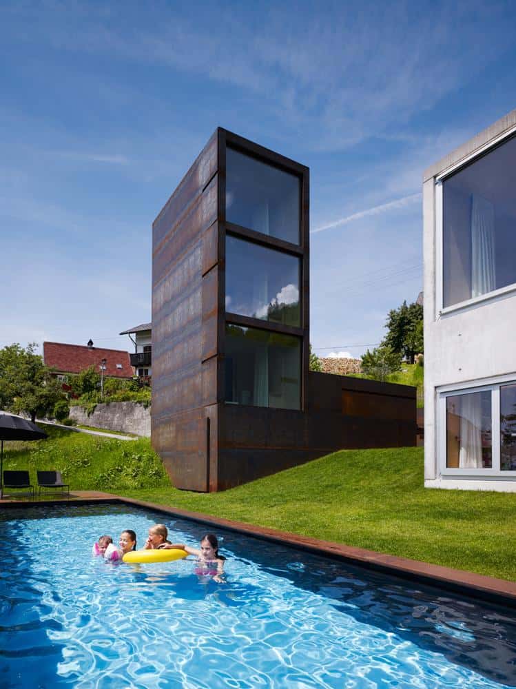 oxidized steel bedroom tower presides house pool 9 tower