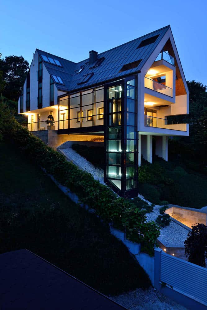 glass-elevator-multiple-levels-slope-house-26-exterior.jpg