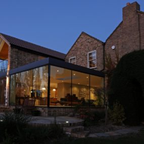 Modern Glass Addition to otherwise Traditional Home