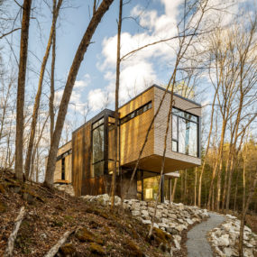 Beauty in Harmony: Cantilevered Lake Cottage with White Cedar Exteriors and White Oak Interiors