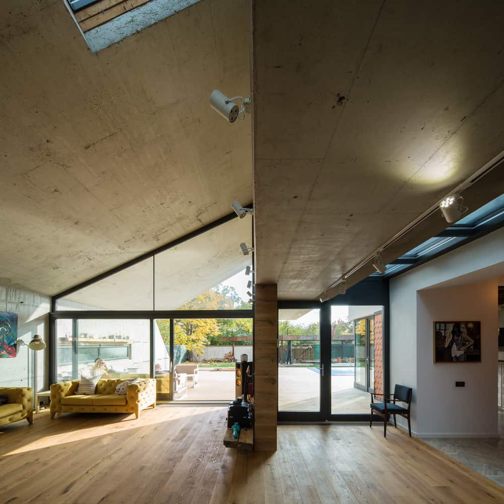 14 asymmetrical concrete addition modernises existing home