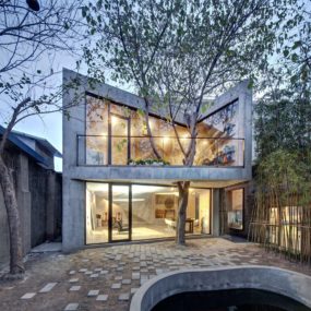 Advanced Digital Architecture and a Tree define this Unique Concrete Home