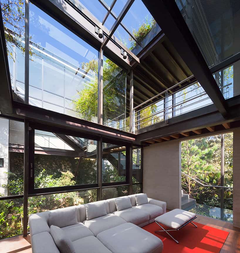 10-outdoor-elevated-glass-walkway-connects-two-sections-house.jpg