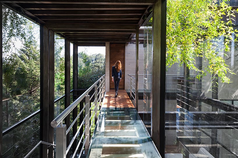 8 outdoor elevated glass walkway connects two sections house