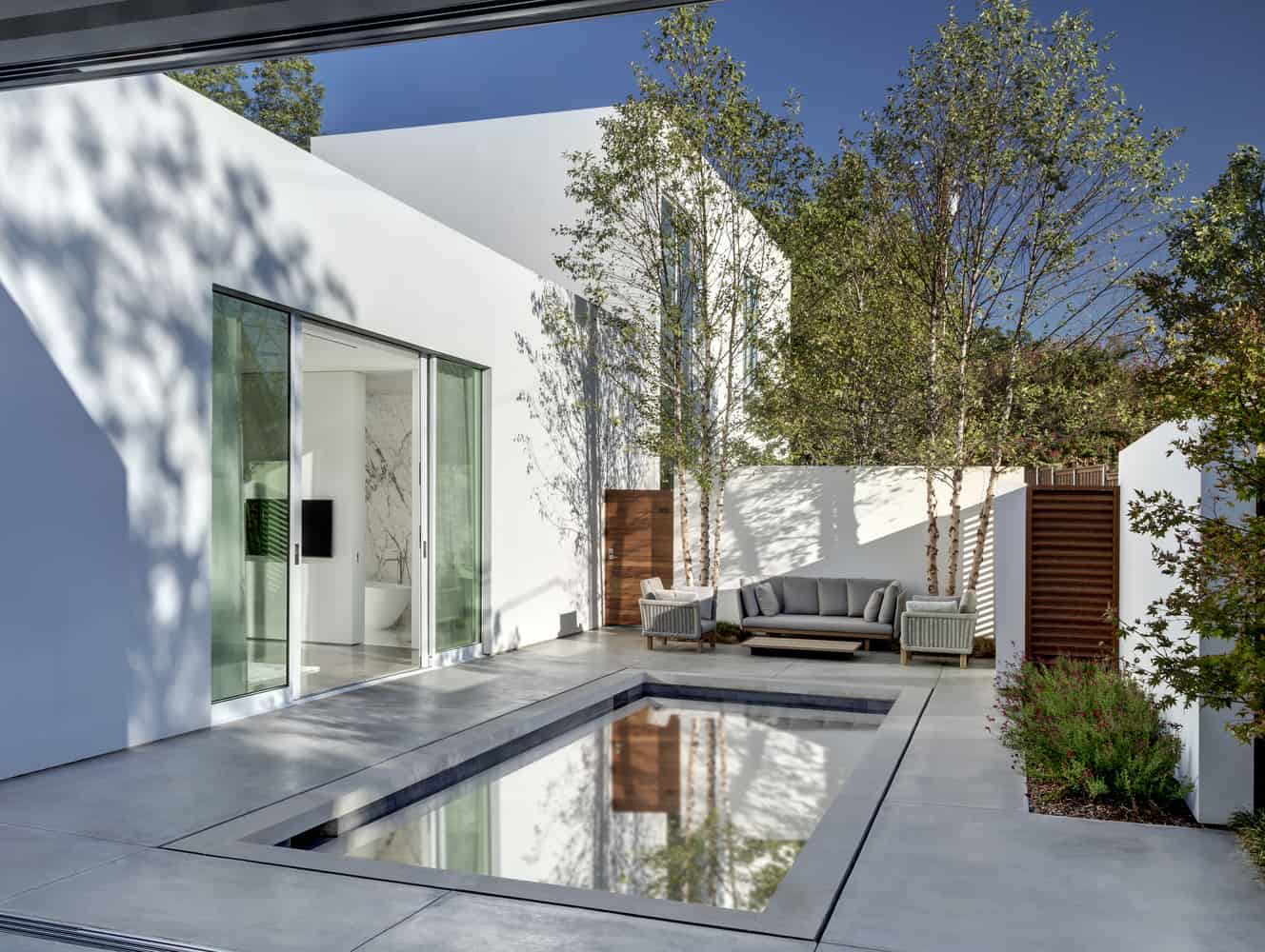 8 contemporary home opens up poolside courtyard