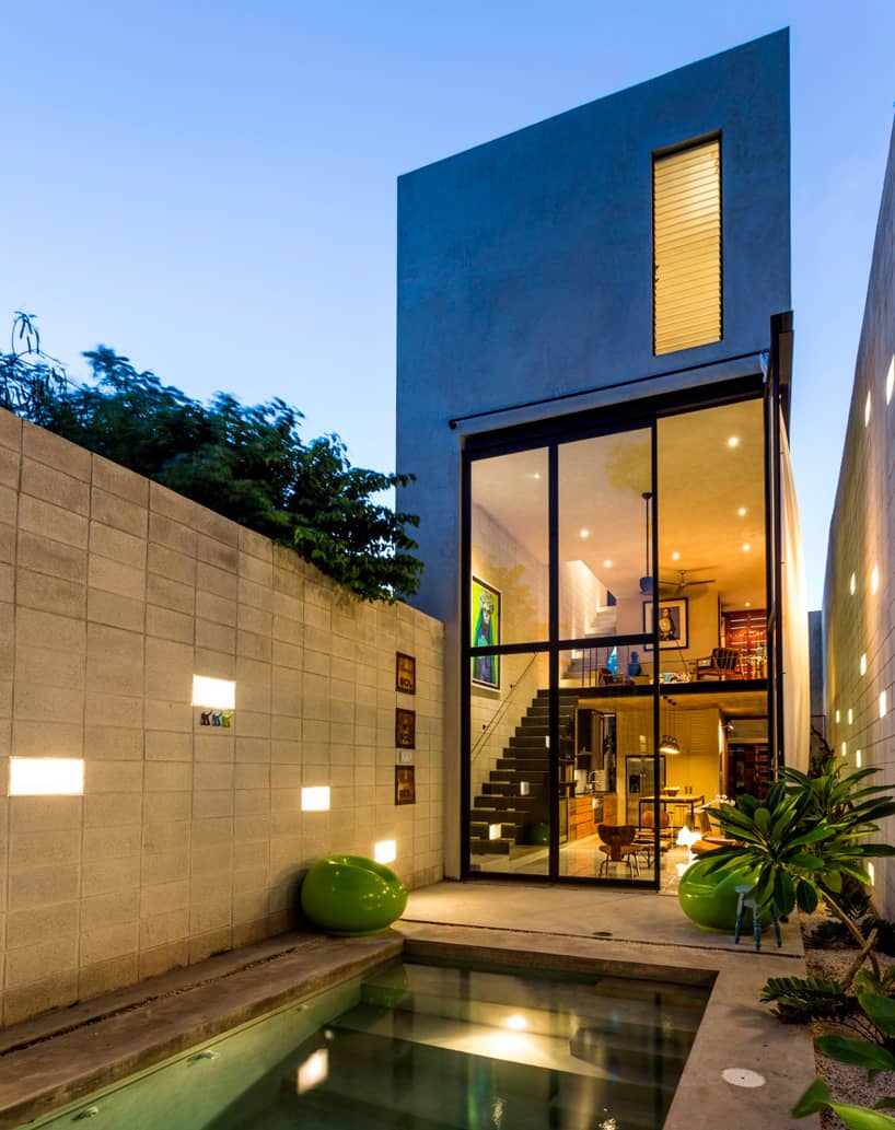 11 skinny concrete home double height glass doors