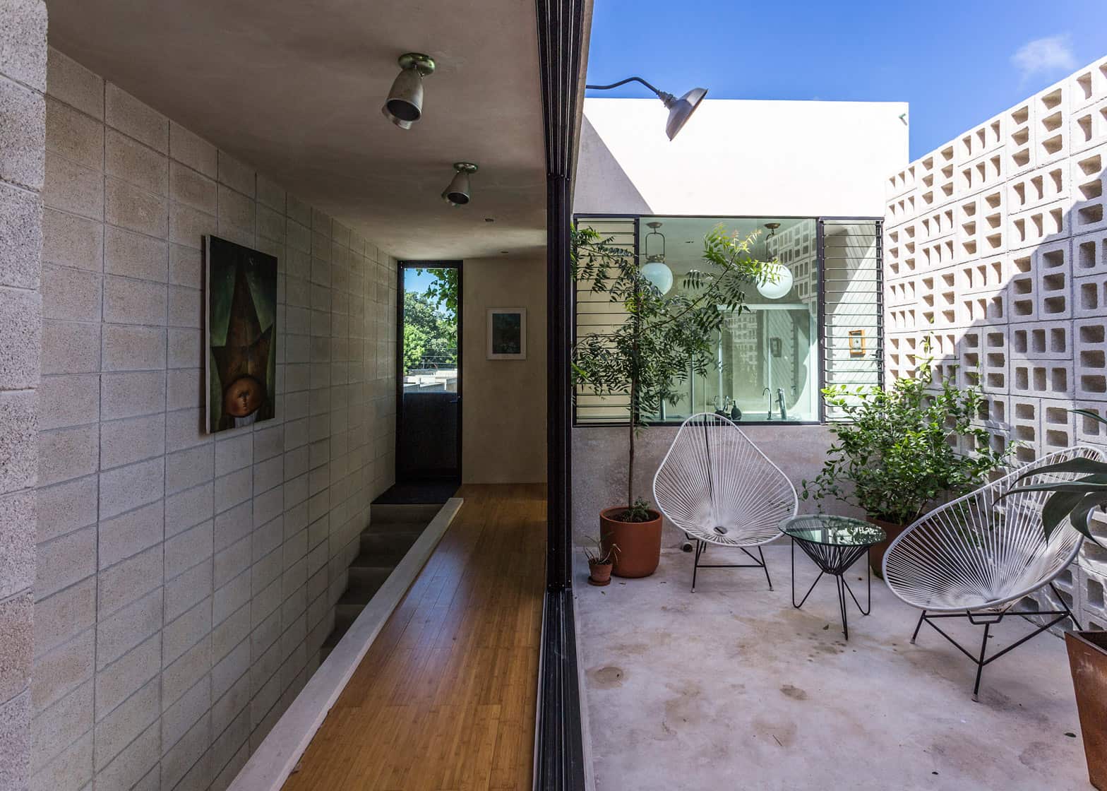 16-skinny-concrete-home-double-height-glass-doors.jpg