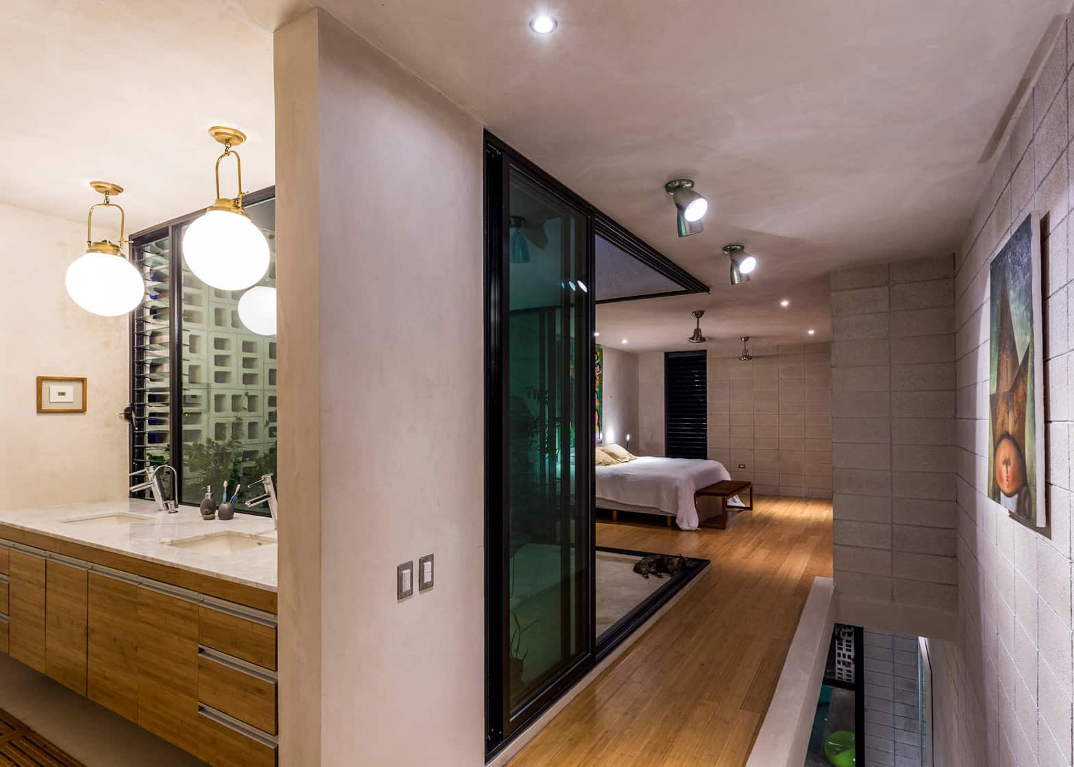 18-skinny-concrete-home-double-height-glass-doors.jpg