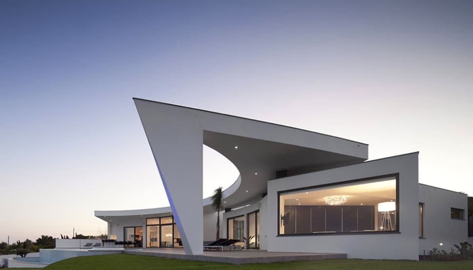 arc house with luxury interiors and edgy curved roof 15