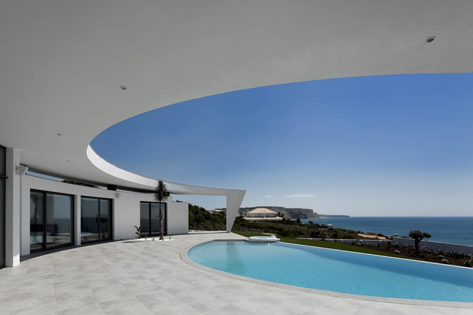 arc house with luxury interiors and edgy curved roof 2