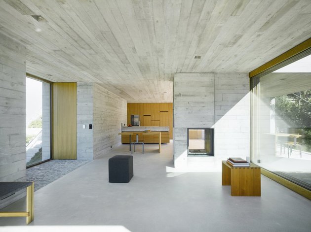 minamalist-concretehome-showcases-stunning-views-and-contemporaryliving-9-fireplace.jpg