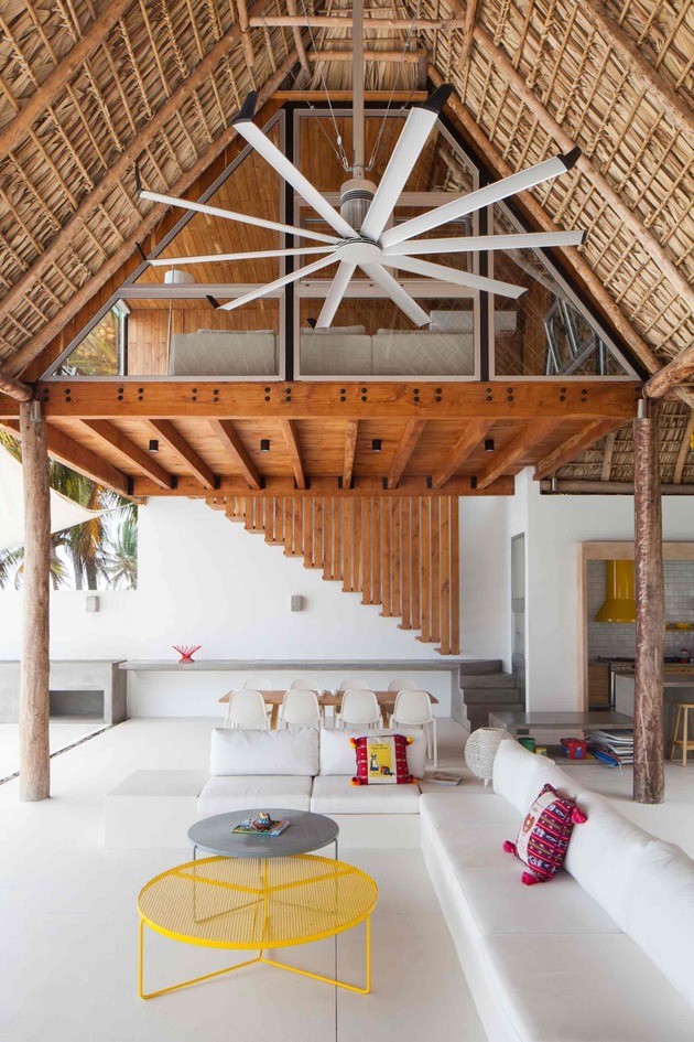colorful-tropical-open-home-rough-cut-thatched-roof-4-tall-indoors.jpg