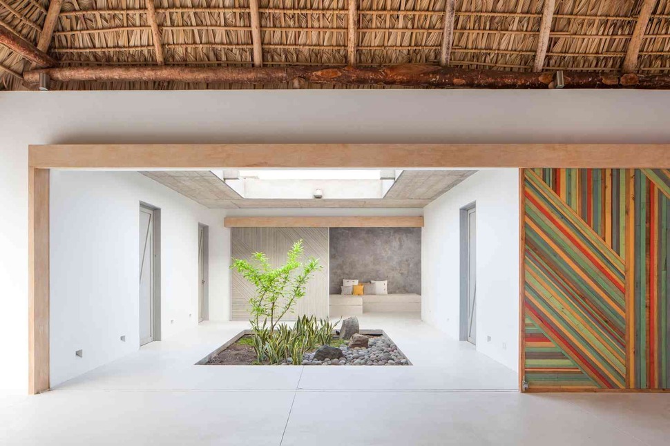 colorful-tropical-open-home-rough-cut-thatched-roof-9-private-space-entrance.jpg