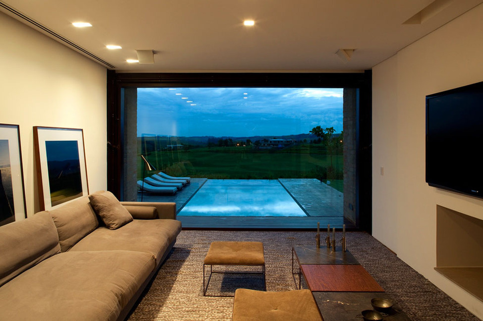 contemporary-hillside-home-brazil-disappears-into-landscape-10-media-room.jpg