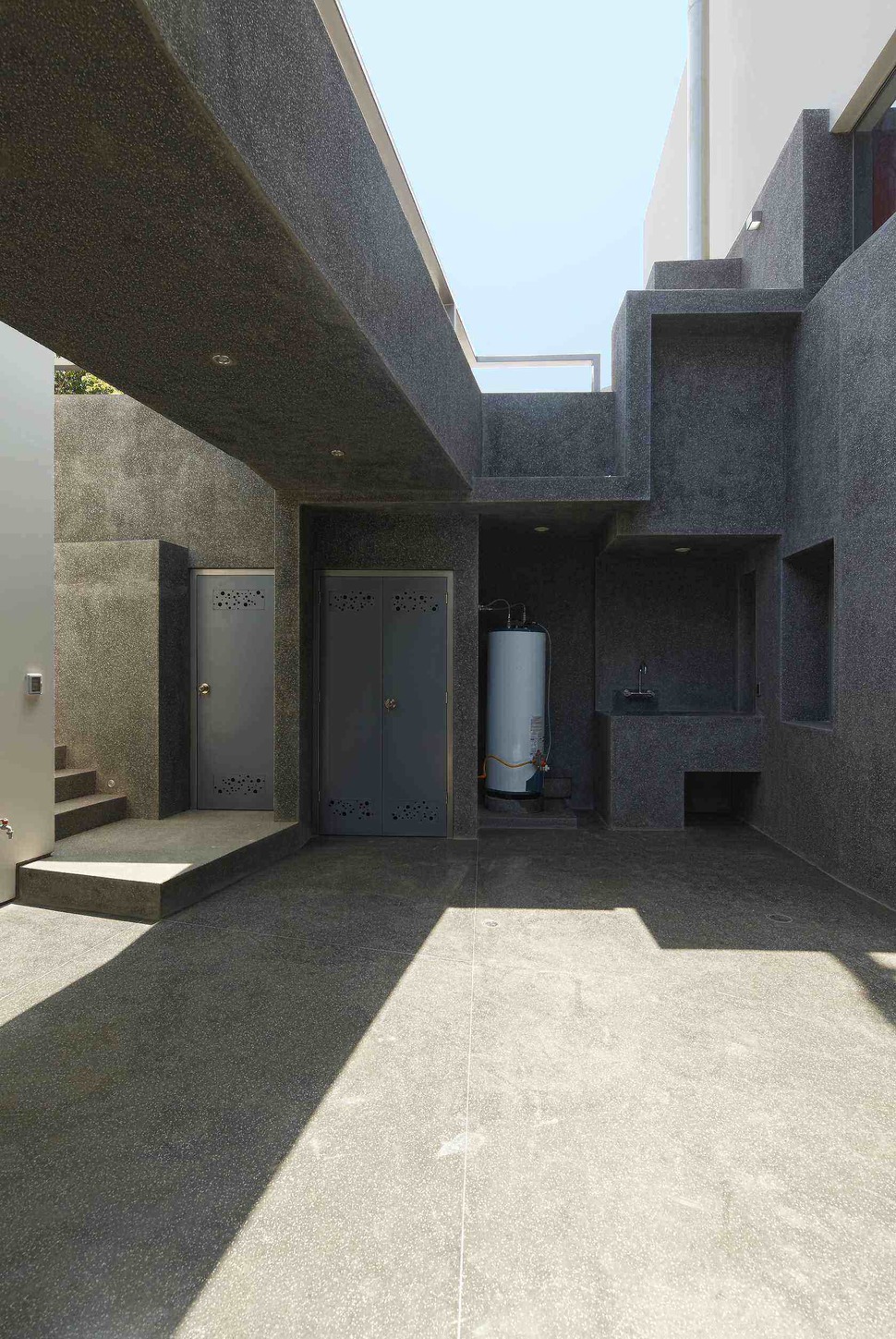 creatively-cool-dual-cantilevered-house-peru-12-downstairs-outdoor-storage.jpg