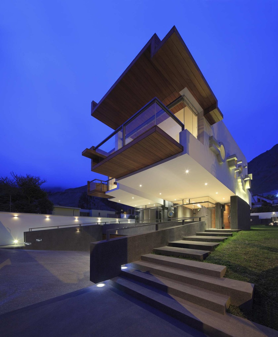 creatively-cool-dual-cantilevered-house-peru-4-front-below-patterned-side-night.jpg