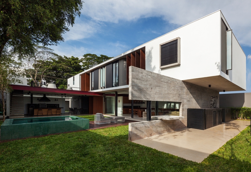 dual-direction-concrete-home-surrounds-poolside-courtyard-brazil-1.jpg