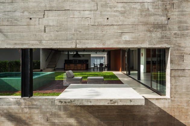 dual-direction-concrete-home-surrounds-poolside-courtyard-brazil-2-concrete-wall.jpg