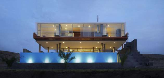 geometric-beach-house-with -floating-glazed-upper-floor-16.jpg