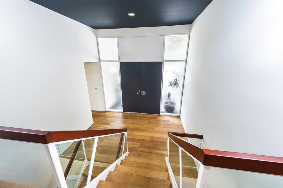 skillful-renovation-iconic-mid-century-los-angeles-residence-13-front-door-stairs.jpg