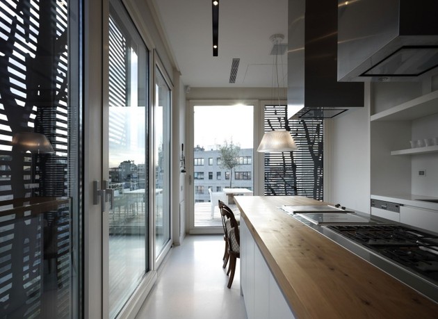 white-shades-define-luxurious-multistory-milan-apartment-9-kitchen-near.jpg