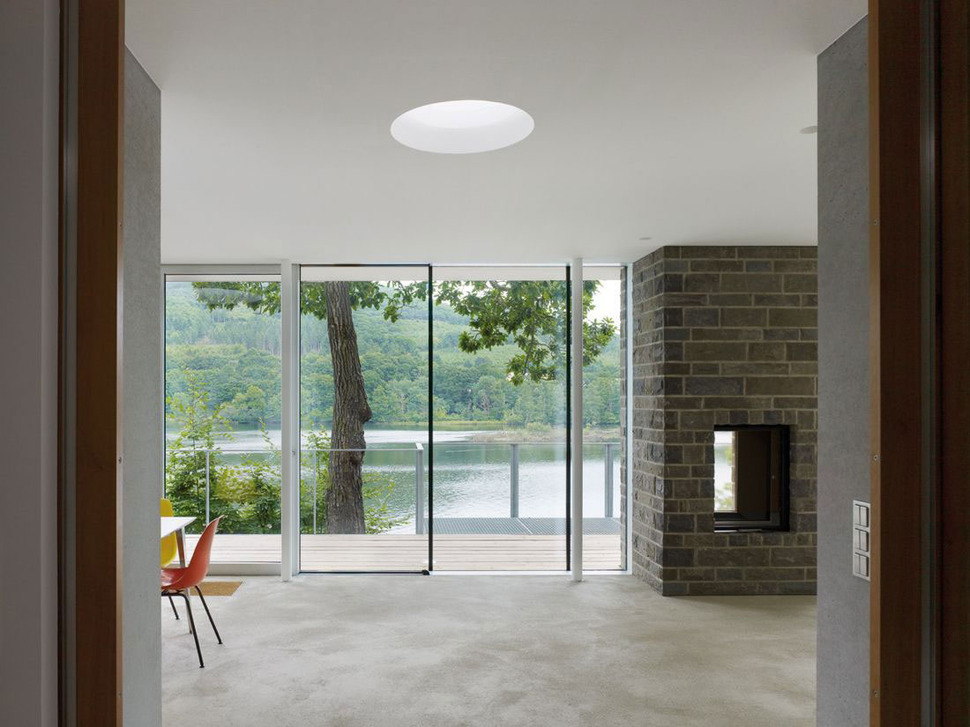 lake-house-above-rur-reservoir-germany-minimalist-masterpiece-5-fireplace.jpg