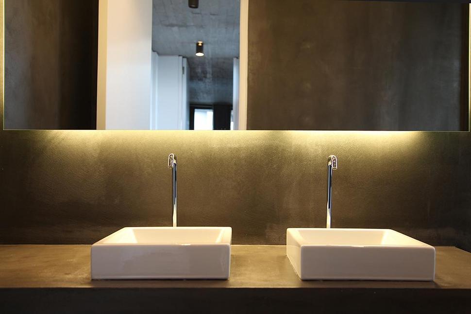 sleek-athens-house-blends-stone-with-concrete-textures-25-bathroom-sinks.jpg
