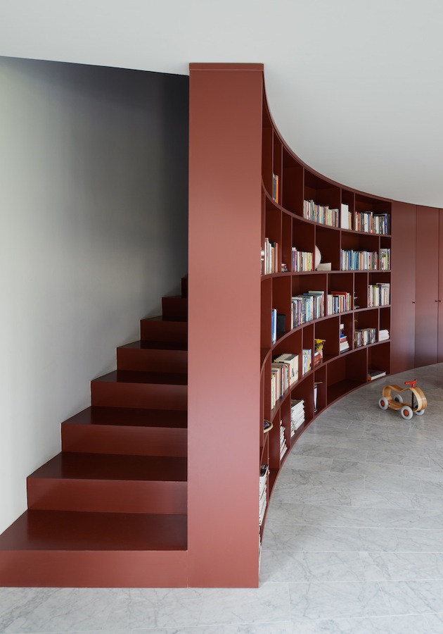 sweeping-swedish-family-home-with-colors-inspired-book-12-stairs-shelves.jpg