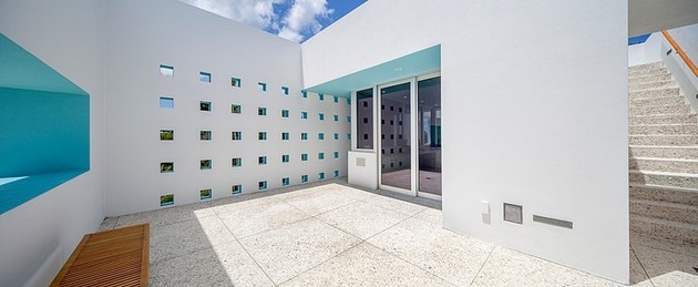 tall-private-florida-home-with-open-indoor-outdoor-hallways-12-bottom-deck.jpg