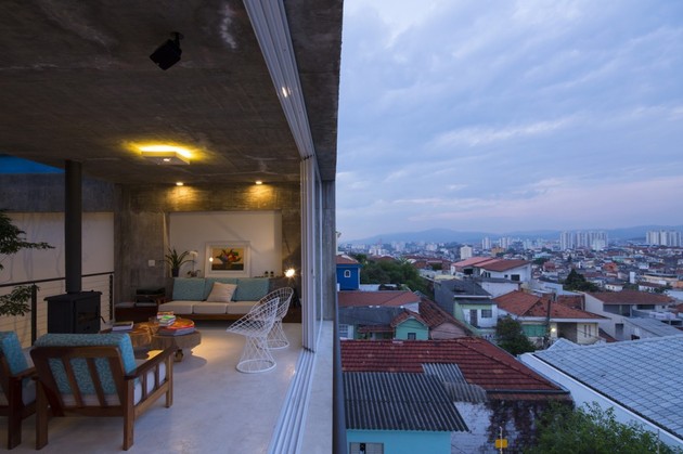 brazilian-concrete-house-built-around-three-story-courtyard-tree-20-outside-living-room.jpg