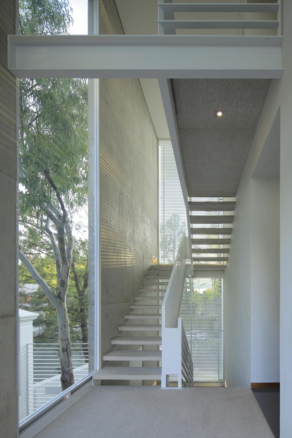 casa-siete-opens-wide-front-back-false-façade-21-outdoor-stairs.jpg