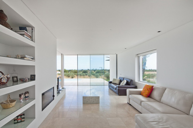 minimalist-white-house-with-glass-walkway-in-olive-grove-14.jpg