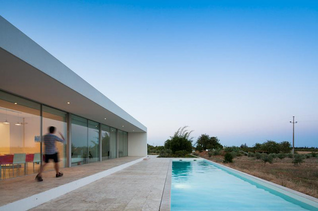 minimalist-white-house-with-glass-walkway-in-olive-grove-20.jpg