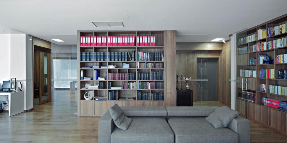 sculptural-circular-stairwell-focus-minimalist-residence-4-library-office.jpg