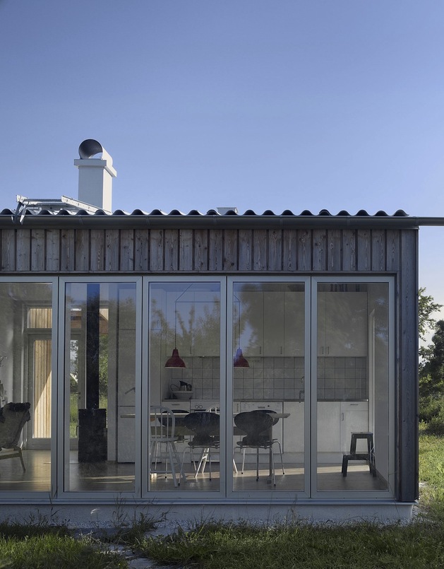 small-swedish-house-made-from-boards-corrugated-metal-5-outside-kitchen.jpg