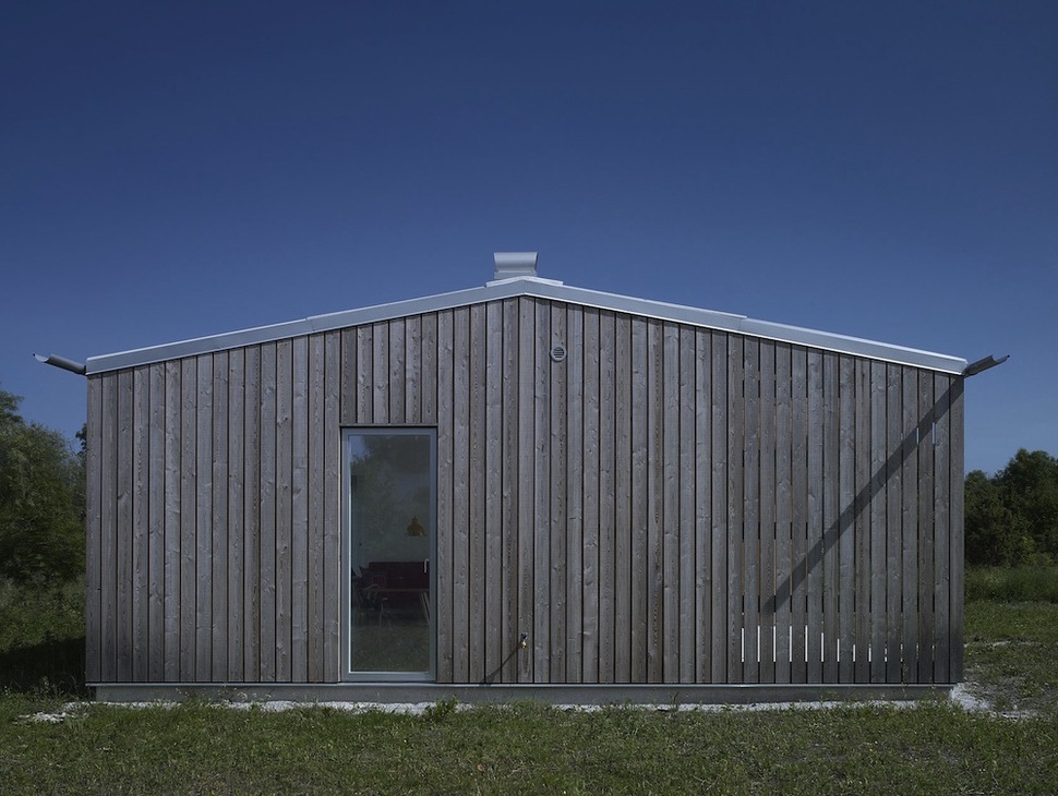 small-swedish-house-made-from-boards-corrugated-metal-6-side.jpg