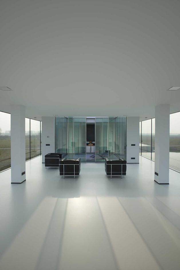striking-minimal-glass-house-elevated-above-barren-landscape-8-living-area-straight.jpg