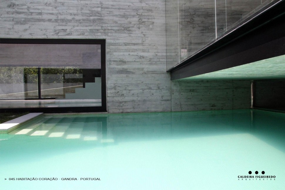 two-wing-portuguese-house-with-concrete-look-wood-exterior-9-pool-steps.jpg