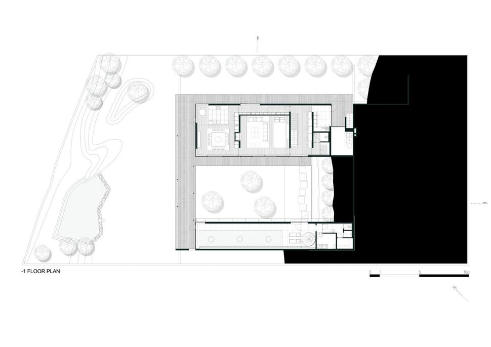 black-home-with-bright-interior-built-into-grassy-hillside-30-bottom-floor.jpg