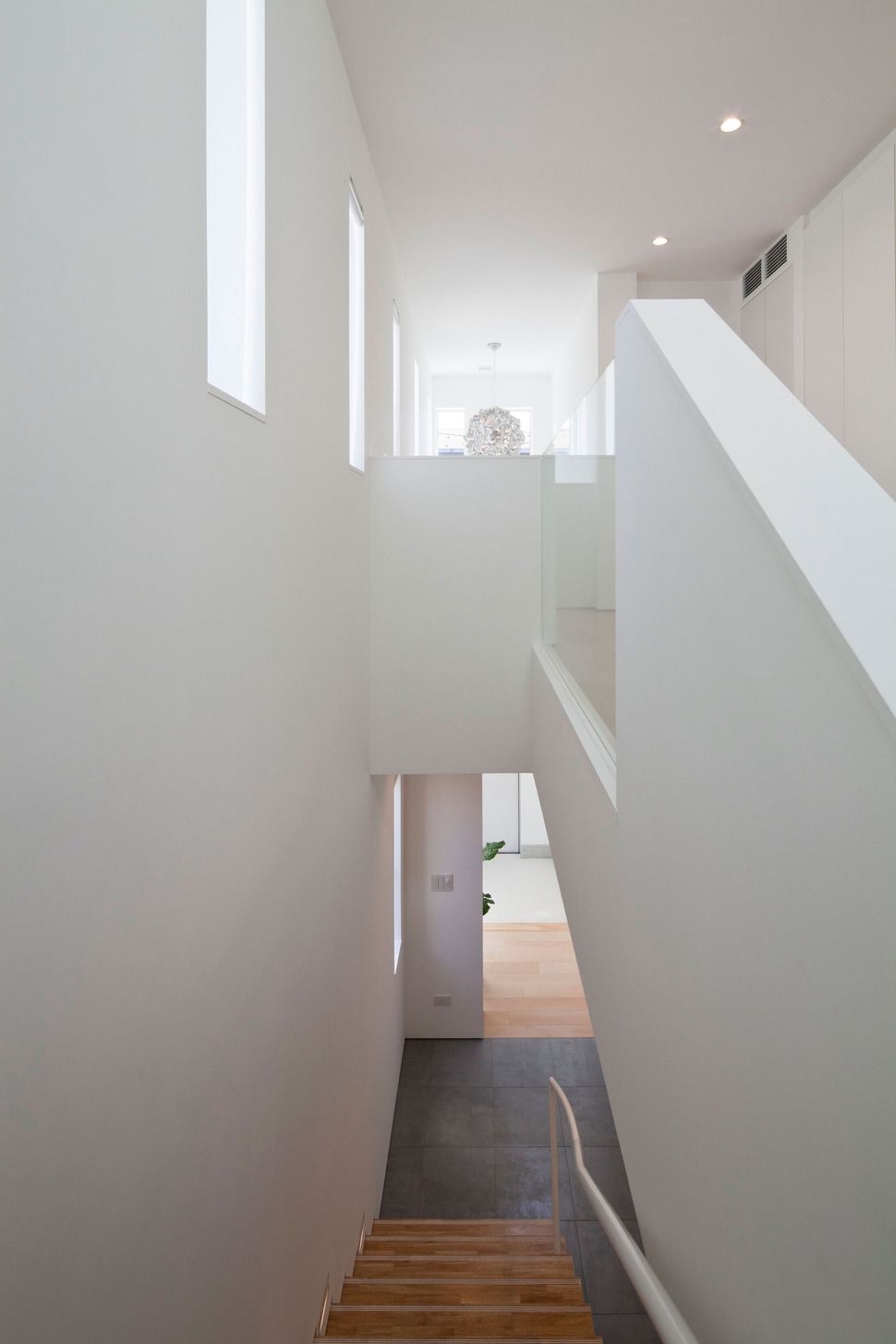 compact-zen-home-full-hidden-meanings-14-stairwell.jpg