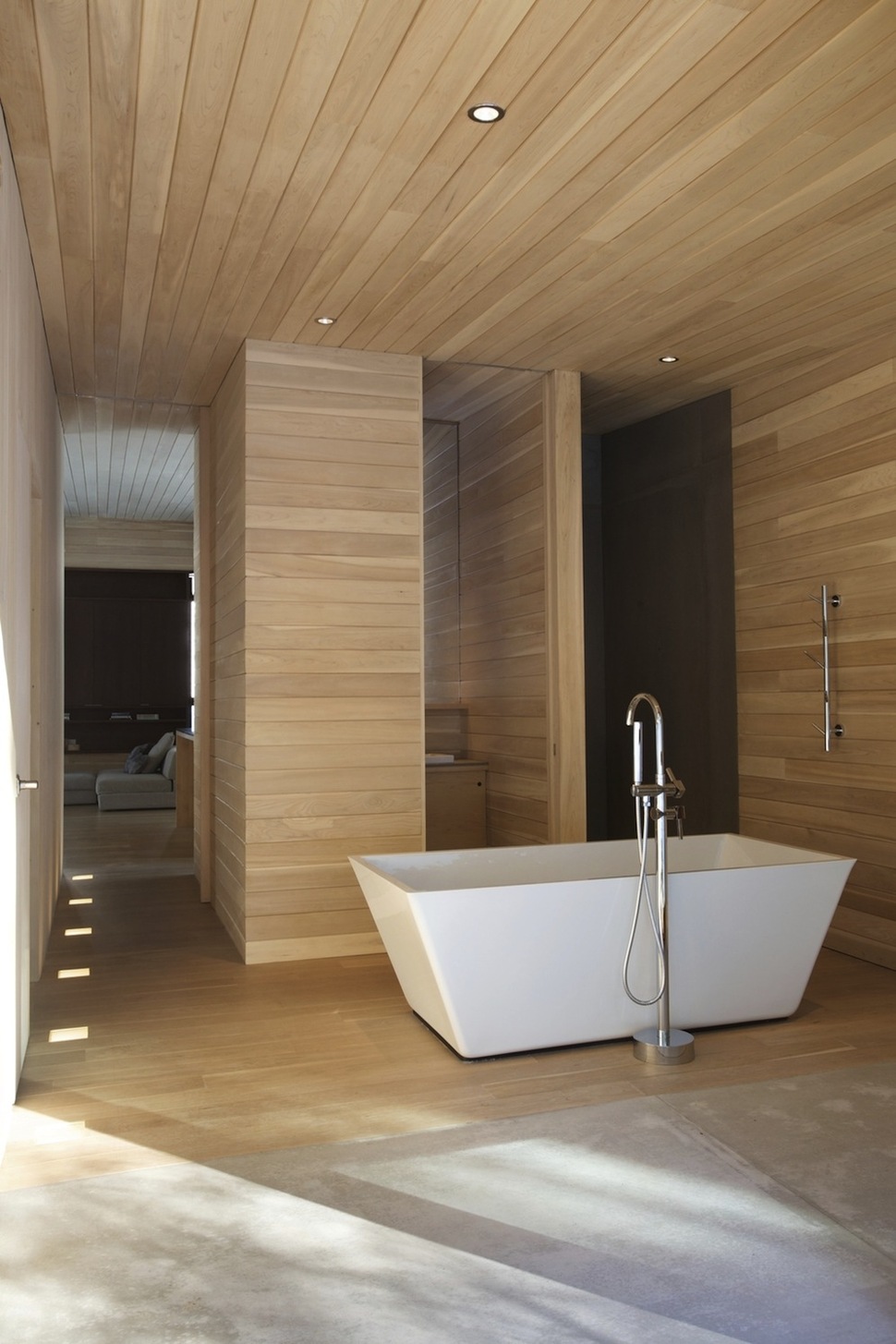 forest-getaway-cabin-dominated-by-warm-wood-boards-11-freestanding-tub.jpg
