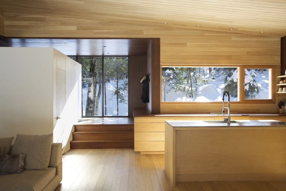 forest-getaway-cabin-dominated-by-warm-wood-boards-5-main-room.jpg
