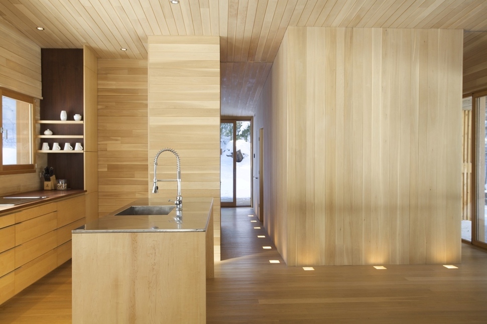 forest-getaway-cabin-dominated-by-warm-wood-boards-7-kitchen-hallway.jpg