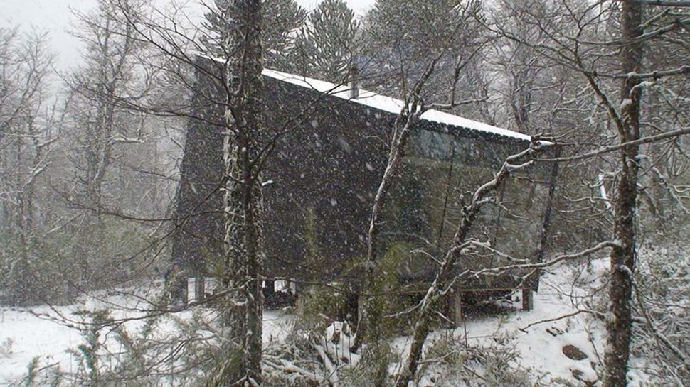 winter-cabin-accessed-elevated-walkway-7-snowing.jpg