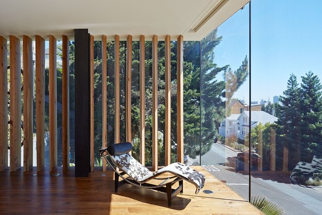 garage-upper-deck-connects-glass-home-slope-15-bedroom.jpg