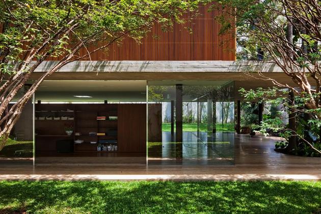 long-glass-house-with-folding-wooden-facade-6-patio-opposite-edge.jpg