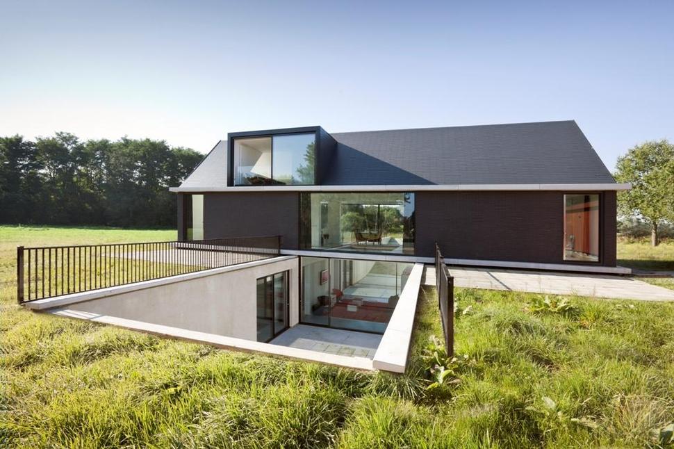 modern-barn-style-home-showcases-glazings-below-grade-ramp-1-ramp.jpg