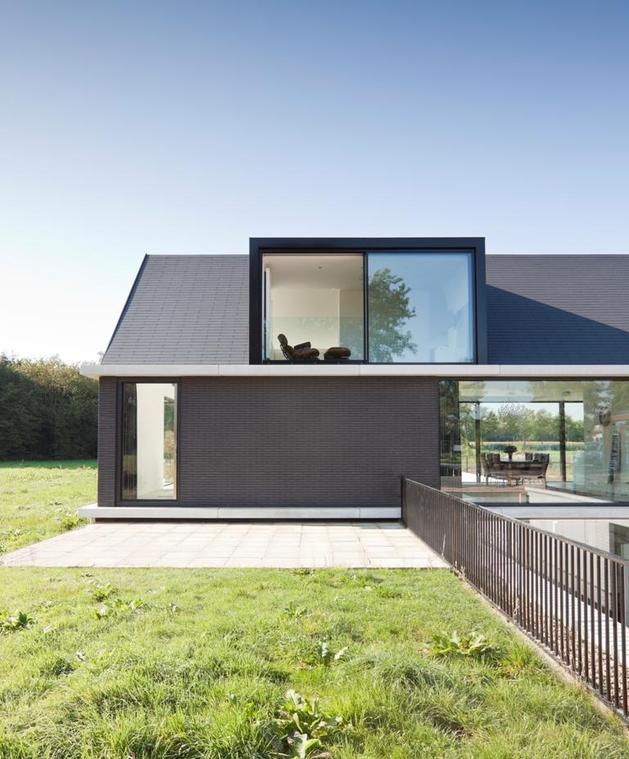 modern-barn-style-home-showcases-glazings-below-grade-ramp-4-dining.jpg