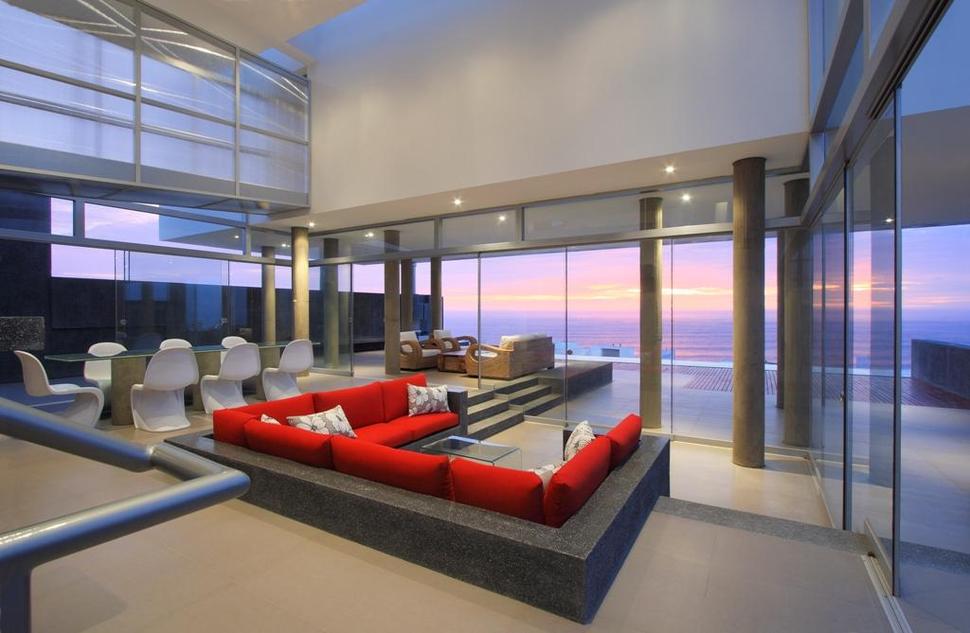 stunning-ultramodern-beach-house-with-glass-walls-7-living-room-evening.jpg